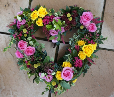 Grouped Open Heart - At Sarah Coxon Floral Design we are delighted to present this product available for flower delivery in Mid and North Norfolk. 

A mixed flower open heart is a modern twist on a traditional funeral tribute. It is full of mixed flowers, which includes groups of Roses, Spray Carnations and other flowers which have been thoughtfully selected to complement the design. It is edged in hand pleated ribbon in a colour co-ordinating waterproof ribbon. 

The flowers are arranged in water retaining foam (oasis) to ensure maximum freshness. 

We deliver directly to all of the local funeral directors and will contact them to confirm a delivery time. 

Standard - approx size 17"

Deluxe - approx size 19"

 

Our flowers at Sarah Coxon Floral Design arrive fresh from the Dutch auctions every day so you can be rest assured we are using the best quality of flowers available. 

If you would like to choose a colour scheme, please state this in the special request box. If no colours have been selected we will use the same colours as the picture.
