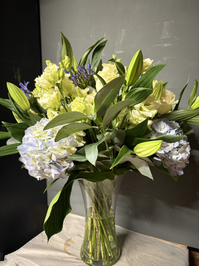 Maison Signature Vase - A stunning collection of seasonal fresh flowers expertly arranged in a handmade glass vase.