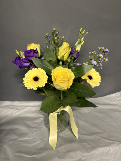 Petite vase - A small glass vase of stunning roses and gerbera, perfect for a little gift for someone special. Available in three sizes, the Classic size is shown.