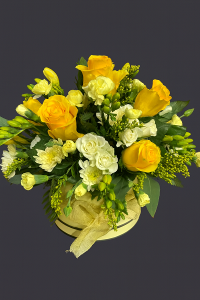 Sunshine Hat Box - A beautiful ray of sunshine in a hat box. A stunning selection of mixed flowers in shades of yellows, will surely be admired!